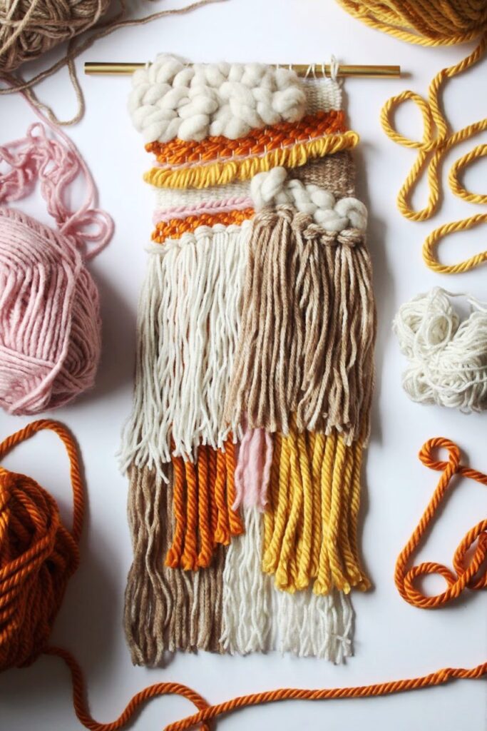 Small textured woven wall hanging in warm autumn tones with soft wool and fringe — Traditional Weaving workshop project